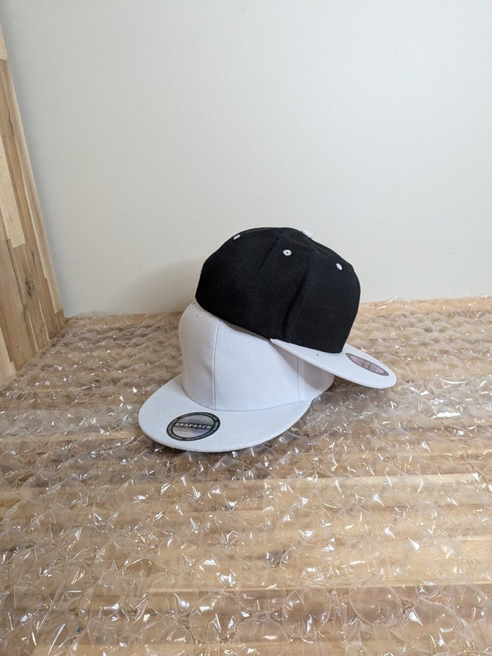 Black and white baseball caps.